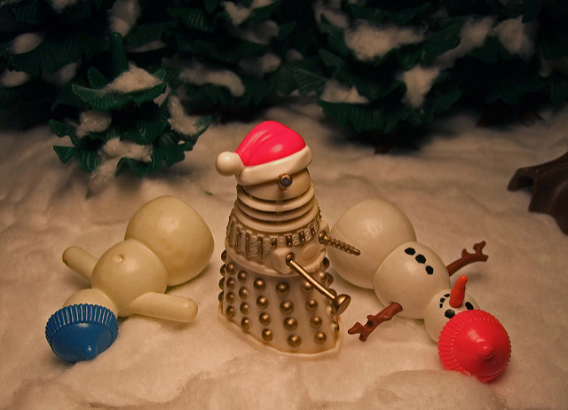 A photo of some Dalek toys with Santa hats